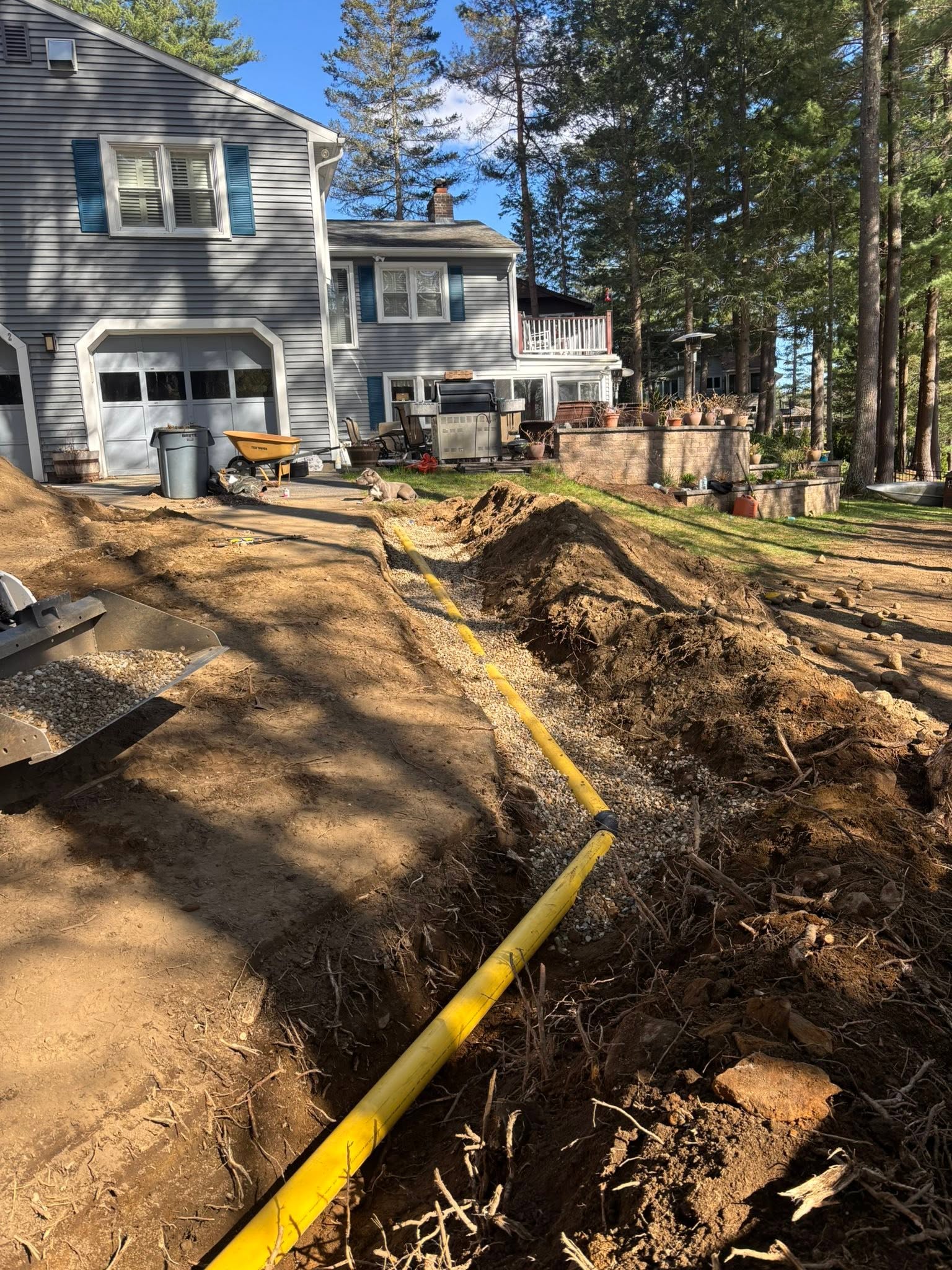 Underground drainage installation in progress — rerouting to edges